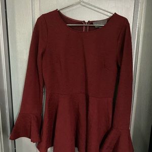 Burgundy long sleeve ruffled top with back zip